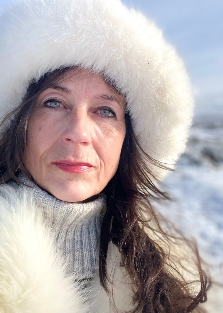 Tara Beckerley in a white fur hat